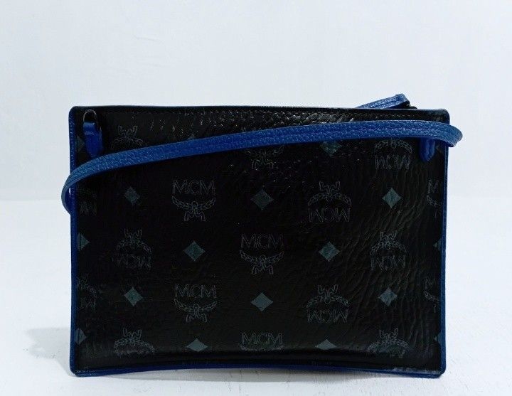 MCM TASCHE POCHETTE ,kili bag ( only ) (Category: Luxury Bags & Wallets) located in Manila. Submitted by eriiicaspage (Listing ID 1427746243, Image 2). Description: PREOWNED LIGHTLY USED MCM Tasche Pochette LEATHER WRISLET /KILI BAG (Only ) SMALL BLACK & BLUE COLORBLOCK LEATHER BRASS hardware YKK Zip wth Small Etiketa intact inside Good Condition 9/10.