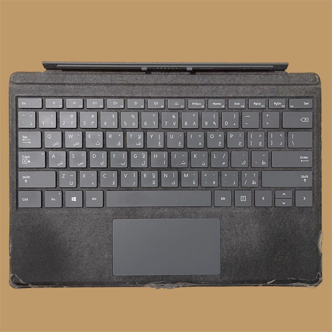Microsoft Surface Pro Keyboard Cover - Defective (Category: Computer Keyboard) located in Subic. Submitted by pepaydeclutters (Listing ID 1427686052, Image 1). Description: For parts!!! Bought from Bahrain Not consistently working (will function for 10 mins then will stop working for 15 mins then will function again, and so on) Backlight and trackpad are still functioning.
