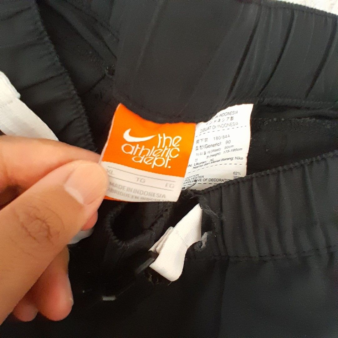 Nike Athletic Dept Shorts - XL (Category: Shorts) located in Baguio. Submitted by UrbanFlip (Listing ID 1427647338, Image 3). Description: Black Nike shorts with an elastic waistband. Features a cargo pocket on the side. The tag indicates an XL size. Made in Indonesia. The shorts have a Nike logo on the side..