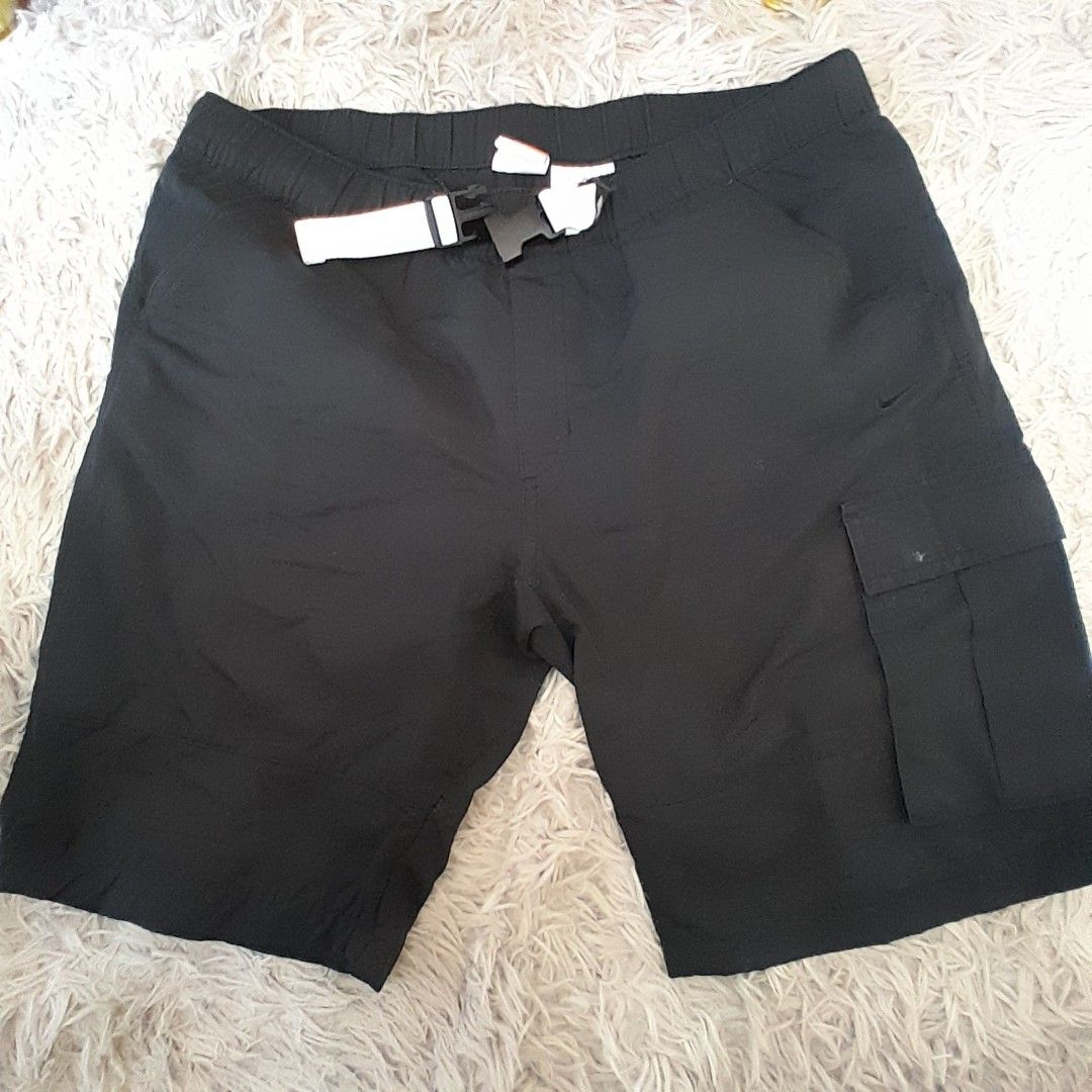 Nike Athletic Dept Shorts - XL (Category: Shorts) located in Baguio. Submitted by UrbanFlip (Listing ID 1427647338, Image 1). Description: Black Nike shorts with an elastic waistband. Features a cargo pocket on the side. The tag indicates an XL size. Made in Indonesia. The shorts have a Nike logo on the side..