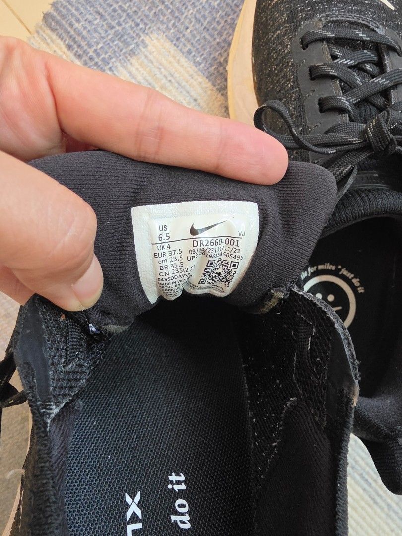 Nike ZoomX Invincible Run Flyknit 3 - Black (Category: Sneakers) located in Manila. Submitted by vevita (Listing ID 1427672789, Image 2). Description: Nike ZoomX Invincible Run Flyknit 3 running shoes in black. Features a white swoosh logo and ZoomX cushioning. The size is US 6.5. The shoes have black laces and a pull tab at the heel. The insole has a smiley face logo. used for less than 30km RFS: flat footed, need to switch to stability shoes.