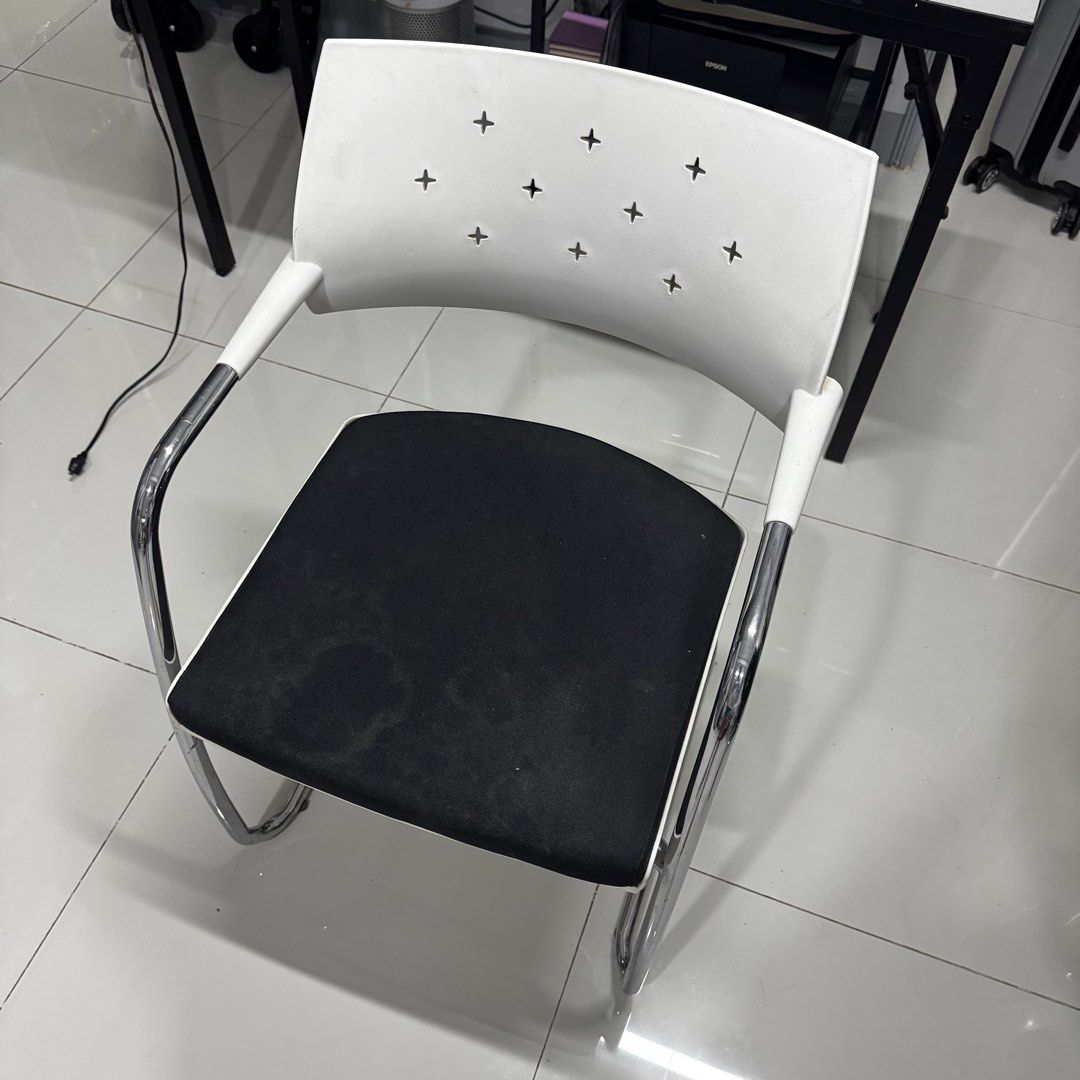 Office Chair with Armrests (Category: Chairs) located in Manila. Submitted by basicstuffmnl (Listing ID 1427752162, Image 1). Description: - Modern office chair - Features armrests - White backrest with a unique pattern - Black seat Metal chair RFS: Got too many chair for solo living 😅.