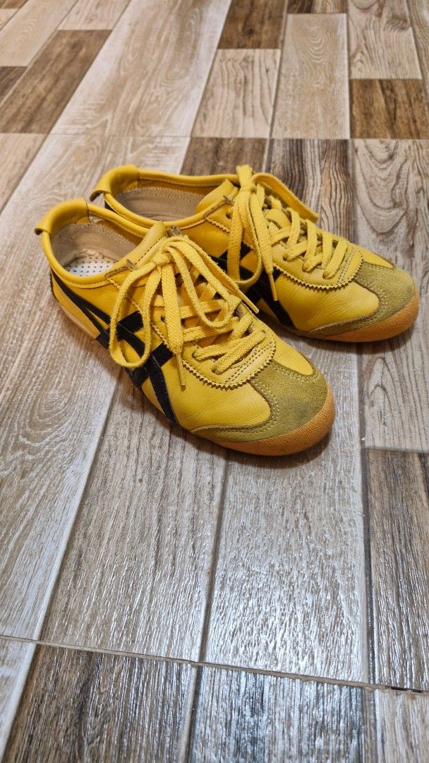 Onitsuka Tiger Mexico 66 "Kill Bill" Yellow/Black (Category: Sneakers) located in Zamboanga. Submitted by _catflakes (Listing ID 1427653527, Image 1). Description: These Onitsuka Tiger sneakers feature a vibrant yellow color with black accents. The shoes have a classic design with laces and the iconic Tiger stripes. The soles are a contrasting brown color. RFS: buying a new colorway Size: 37 Eu/23 cm There are small paint chips on the black strip