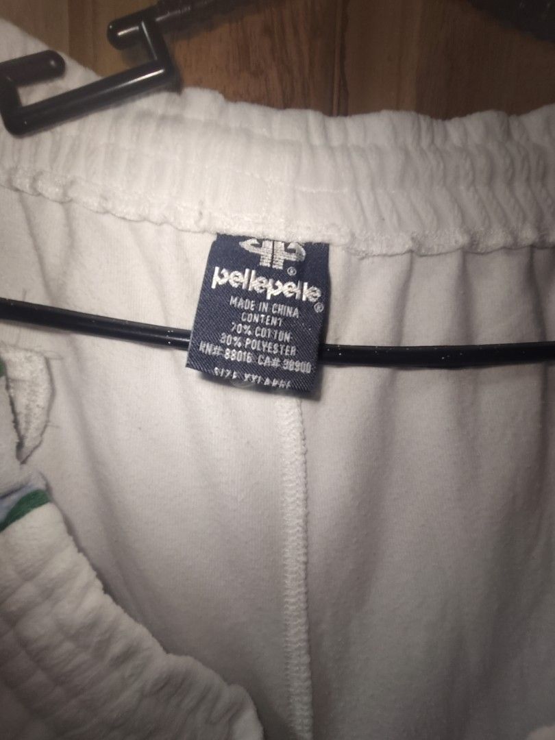 Pelle Pelle Velour Pants (Category: Jeans) located in Tuguegarao City. Submitted by xiraaaaa (Listing ID 1427749588, Image 3). Description: White velour pants from Pelle Pelle. Features blue and green stripes on the sides. Has an elastic waistband and a small logo on the leg. Made of 70% cotton and 30% polyester. issue: minimal yellow stain washable nmn dm na!!.
