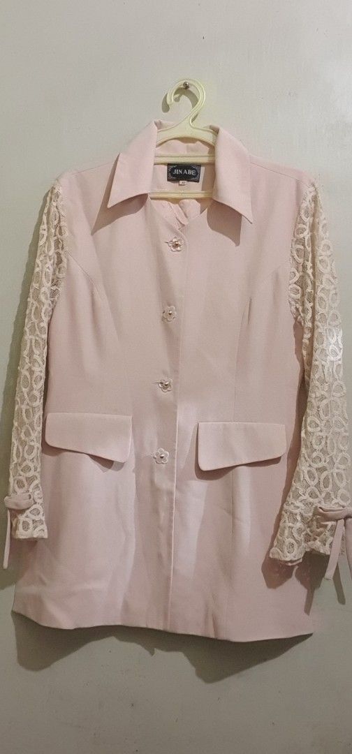 Pink Blazer with Lace Sleeves (Category: Coats, Jackets and Outerwear) located in Marikina City. Submitted by thezoneheads (Listing ID 1427718763, Image 1). Description: Elegant pink blazer featuring lace sleeves and a classic collar. It has three buttons down the front and two pockets. The sleeves have tie details at the cuffs. The back of the blazer has a simple, tailored design..