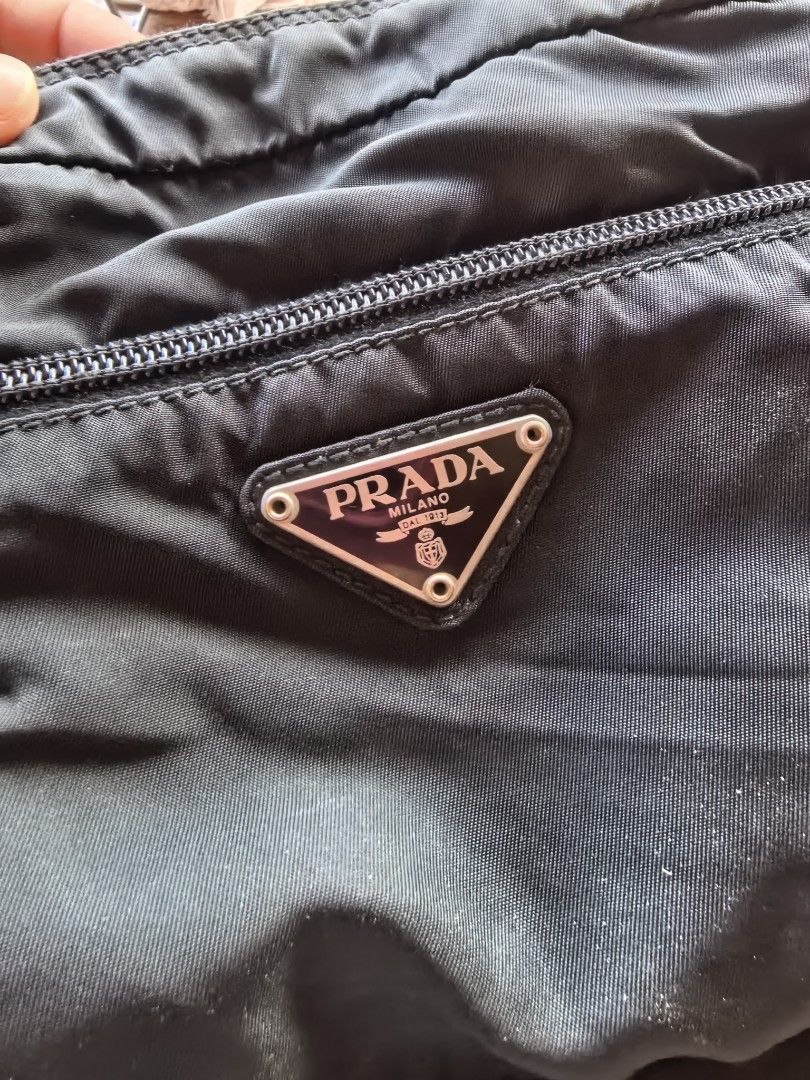Prada Black Nylon Crossbody Bag (Category: Luxury Bags & Wallets) located in Sipalay. Submitted by muedajerry (Listing ID 1427751253, Image 3). Description: Prada nylon bag Legit Issue no inside lining Color rate 9/10 3500.