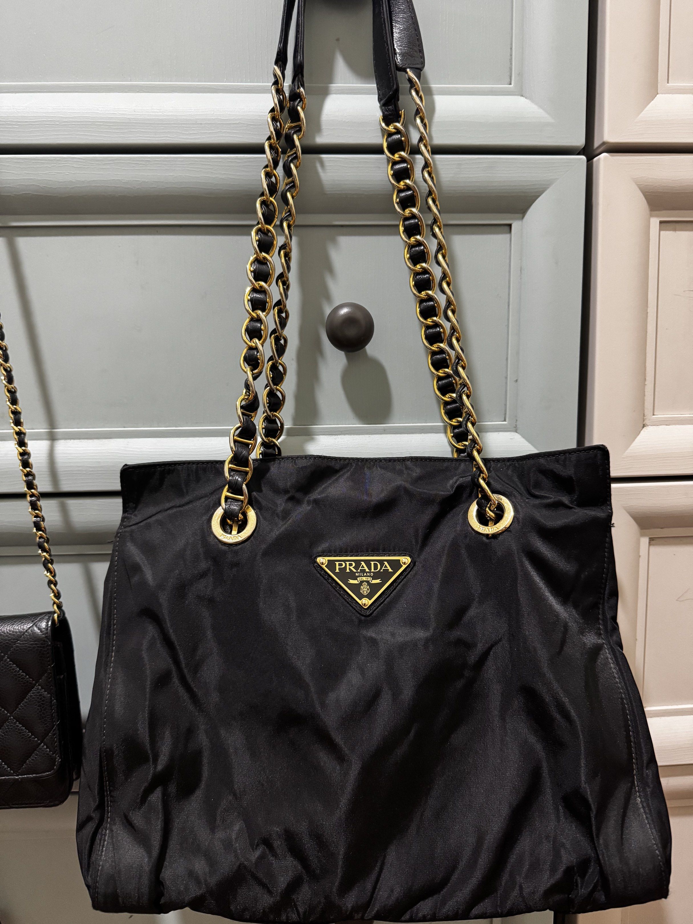 Prada Tessuto Nylon Chain Shoulder Bag in Black (Category: Luxury Bags & Wallets) located in Makati City. Submitted by wanderfullshop (Listing ID 1427642934, Image 1). Description: All 4 chains/handle were recently reconstructed by Besa to make them stronger and more durable..
