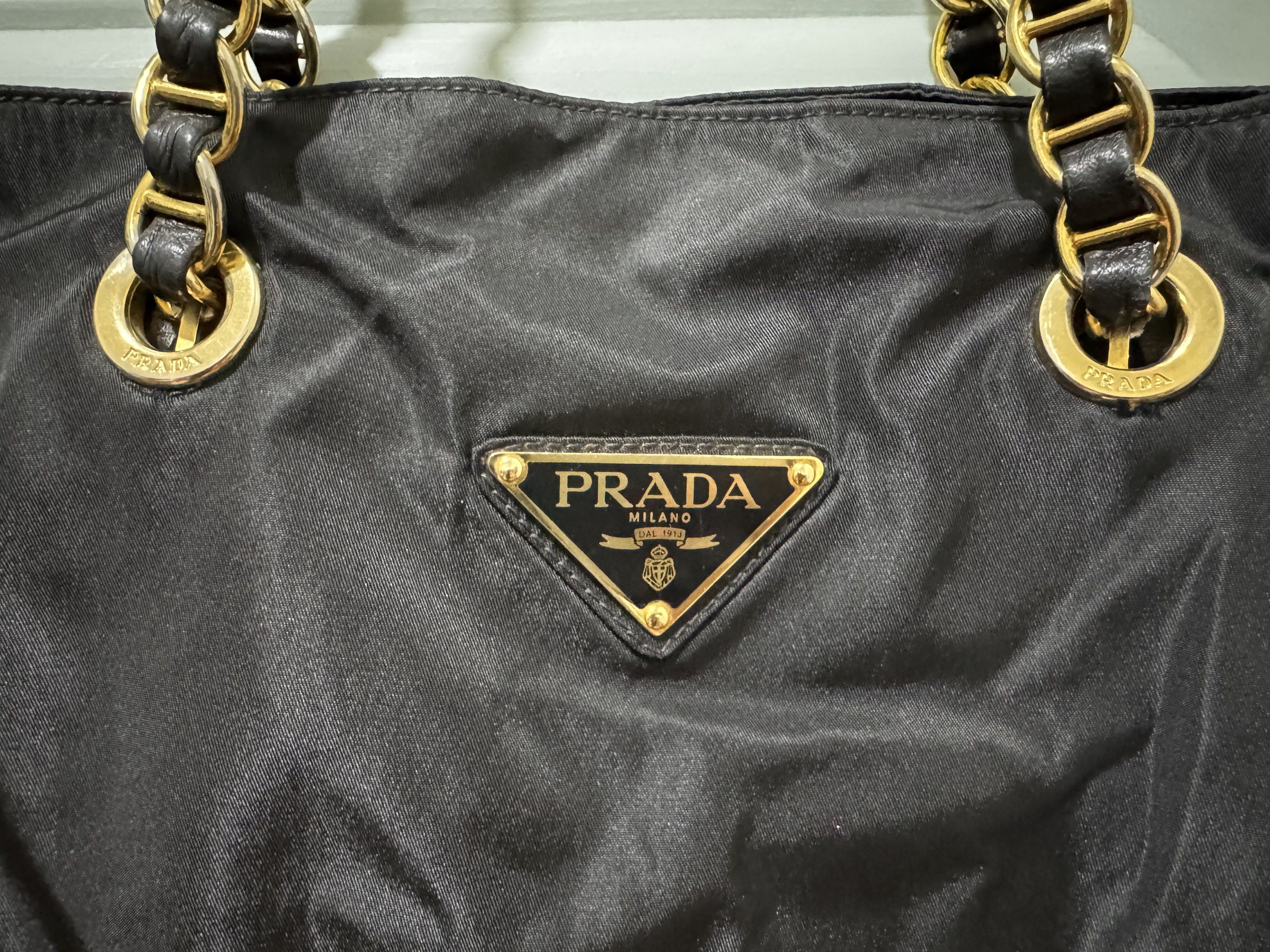 Prada Tessuto Nylon Chain Shoulder Bag in Black (Category: Luxury Bags & Wallets) located in Makati City. Submitted by wanderfullshop (Listing ID 1427642934, Image 2). Description: All 4 chains/handle were recently reconstructed by Besa to make them stronger and more durable..