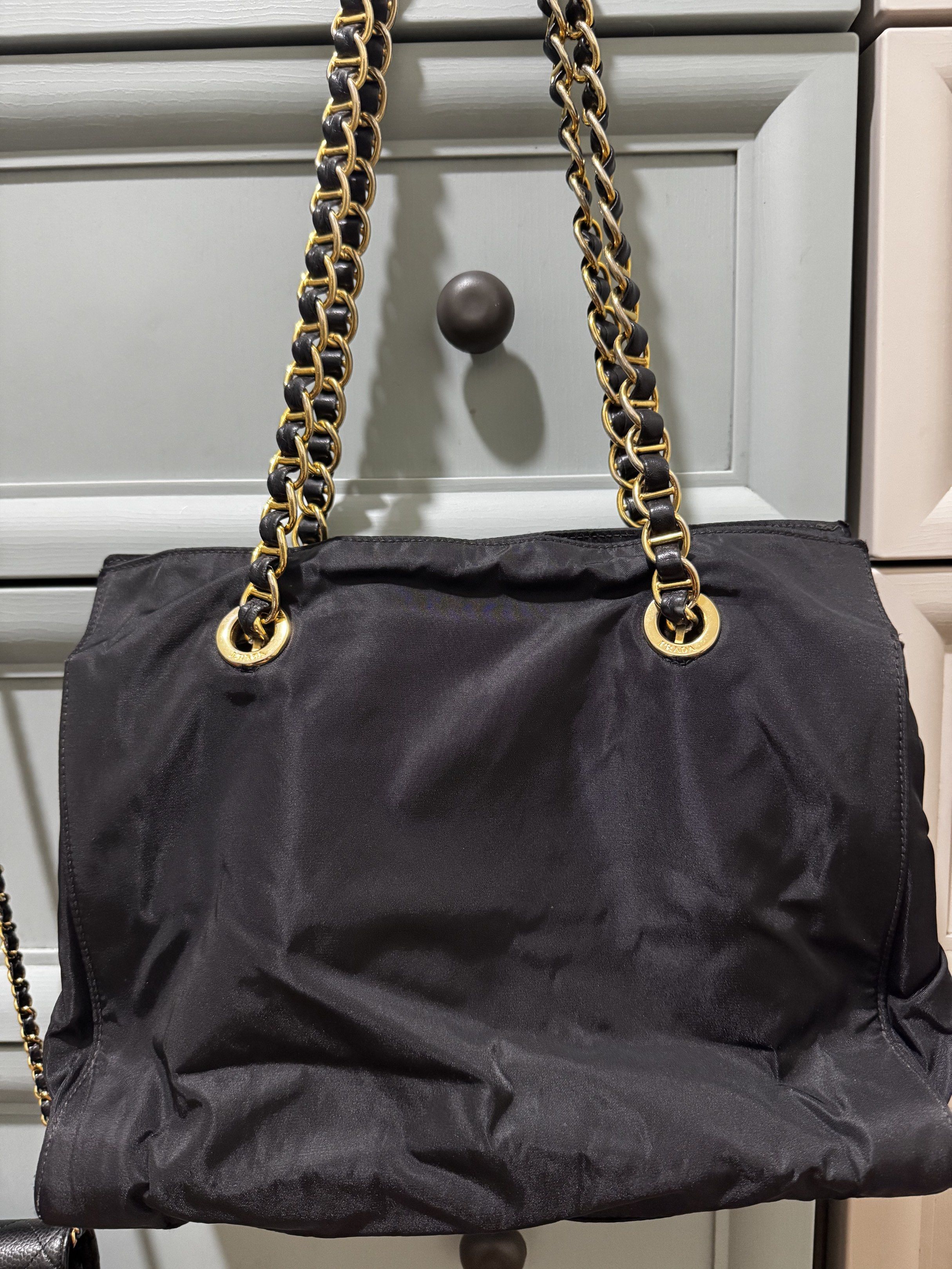 Prada Tessuto Nylon Chain Shoulder Bag in Black (Category: Luxury Bags & Wallets) located in Makati City. Submitted by wanderfullshop (Listing ID 1427642934, Image 3). Description: All 4 chains/handle were recently reconstructed by Besa to make them stronger and more durable..