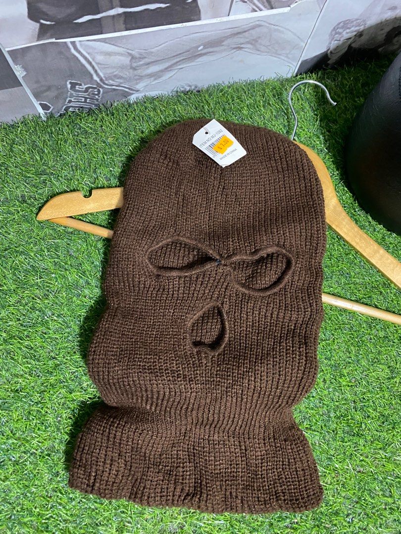 ROBBER MASK | BALACLAVA DARK BROWN AS NEW CONDITION (Category: Caps & Hats) located in Polomolok. Submitted by SafeThrift (Listing ID 1427723141, Image 1). Description: ROBBER MASK | BALACLAVA DARK BROWN AS NEW CONDITION NO ISSUES 9.9|10 COLOR RATE ADULT FITS ALL - Brown knitted balaclava - One size fits all - Features holes for eyes and mouth - Includes attached tag - Perfect for warmth or a unique look.