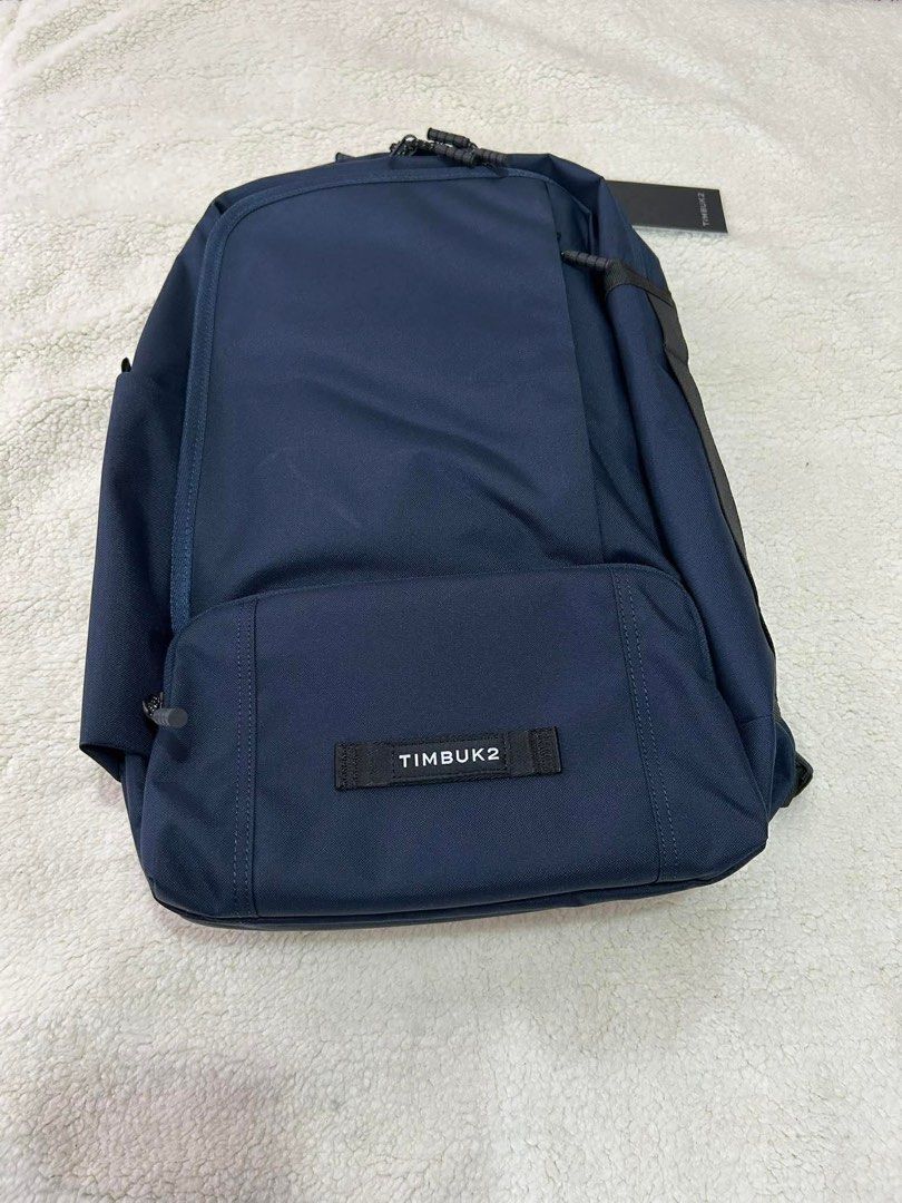 Timbuk2 Parker Backpack (Category: Backpacks) located in General Trias. Submitted by charlie.shop (Listing ID 1427757325, Image 2). Description: Timbuk2 Parker Backpack in navy blue. Features multiple compartments, including a padded laptop sleeve and a front organizer pocket. Includes a water bottle pocket and a key leash. The interior is made with recycled materials. The backpack has padded shoulder straps and a breathable back panel for comfor