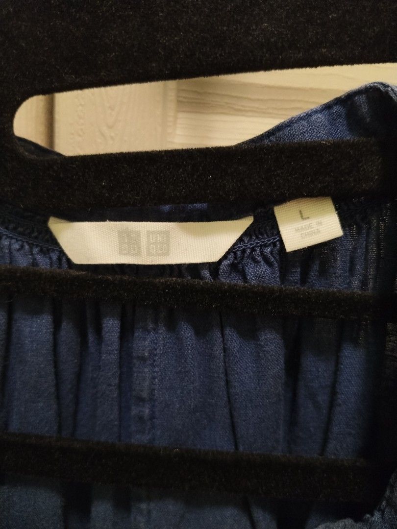 Uniqlo blue linen blend top (Category: Blouses) located in Lipa City. Submitted by abubotcorner (Listing ID 1427718342, Image 3). Description: Uniqlo top is made from a blend of linen and rayon. It features a V-neck design and short sleeves. The size is L, and it is a blue colour. The top is made in China. The bust size is 84-92cm. The material composition is 55% linen and 45% rayon..
