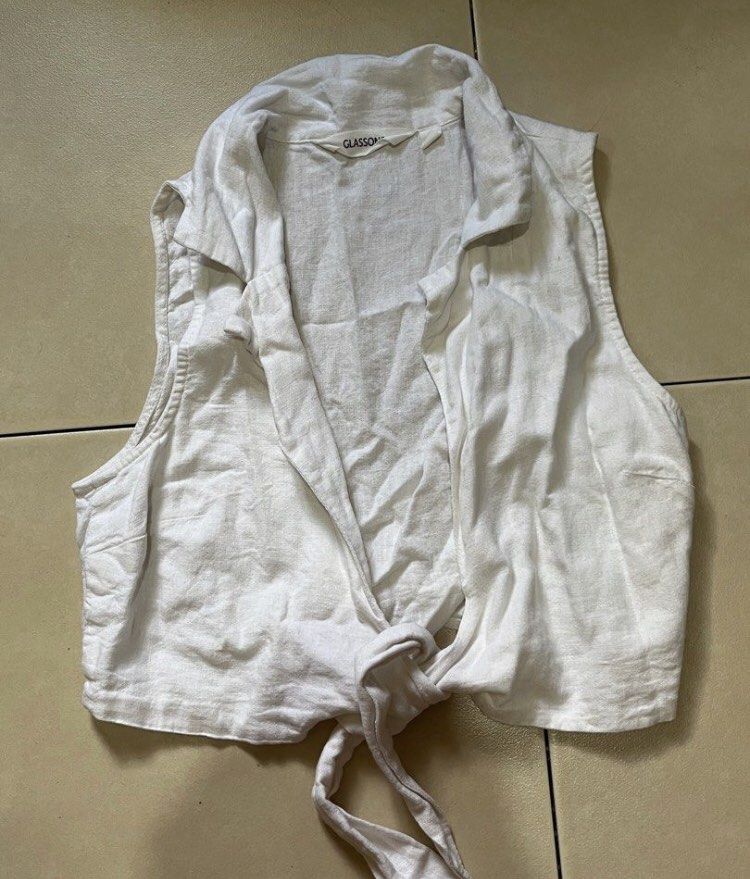 White linen polo tie top (Category: Sleeveless) located in Makati City. Submitted by biotch (Listing ID 1427687172, Image 1). Description: Perfect this summer! Fits xxs-xs No flaws Same day delivery makati area asymmetrical Cotton on Nike new balance asics adidas Lululemon bershka skims sports leggings sportsbra H&M bershka corporate skirt skort zara pomelo thrift baggy jeans wide leg denim cotton on vintage classy short tank top urban revivo uni