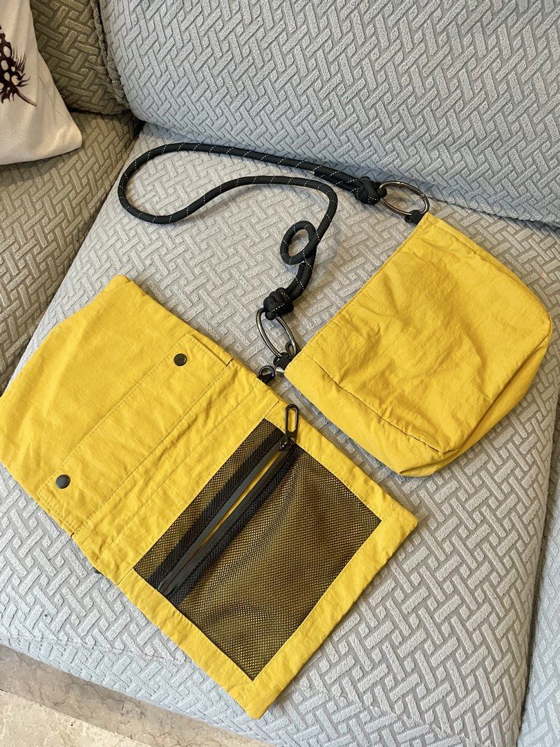 Yellow Crossbody Bag with Rope Strap (Category: Cross-body Bags) located in Quezon City. Submitted by mixeditemsforsale (Listing ID 1427764838, Image 2). Description: Crossbody bag features a vibrant yellow color and a unique rope strap. It has multiple compartments, including a zippered front pocket and an interior mesh pocket. The bag's design includes a detachable pouch..