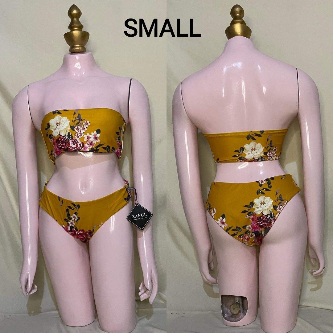 Zaful Floral Bikini - Small (Category: Bikinis & Swimsuits) located in Malabon City. Submitted by WanderThingsPH (Listing ID 1427725952, Image 1). Description: Zaful bikini features a vibrant floral print in yellow. It includes a bandeau top and a matching bottom. The size is small. The bikini is new with tags attached. Perfect for your next beach trip or pool party..