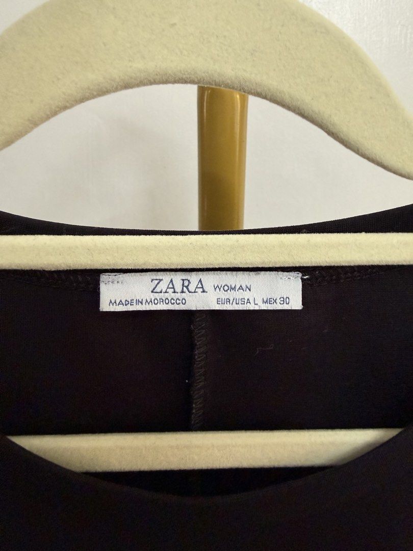 Zara Black Ruffle Hem Dress (Category: Dresses) located in Lasam. Submitted by einalem1234 (Listing ID 1427761928, Image 3). Description: Black dress from Zara. Features a round neckline, short sleeves, and a ruffle hem. Size Large. A simple and versatile dress suitable for various occasions..