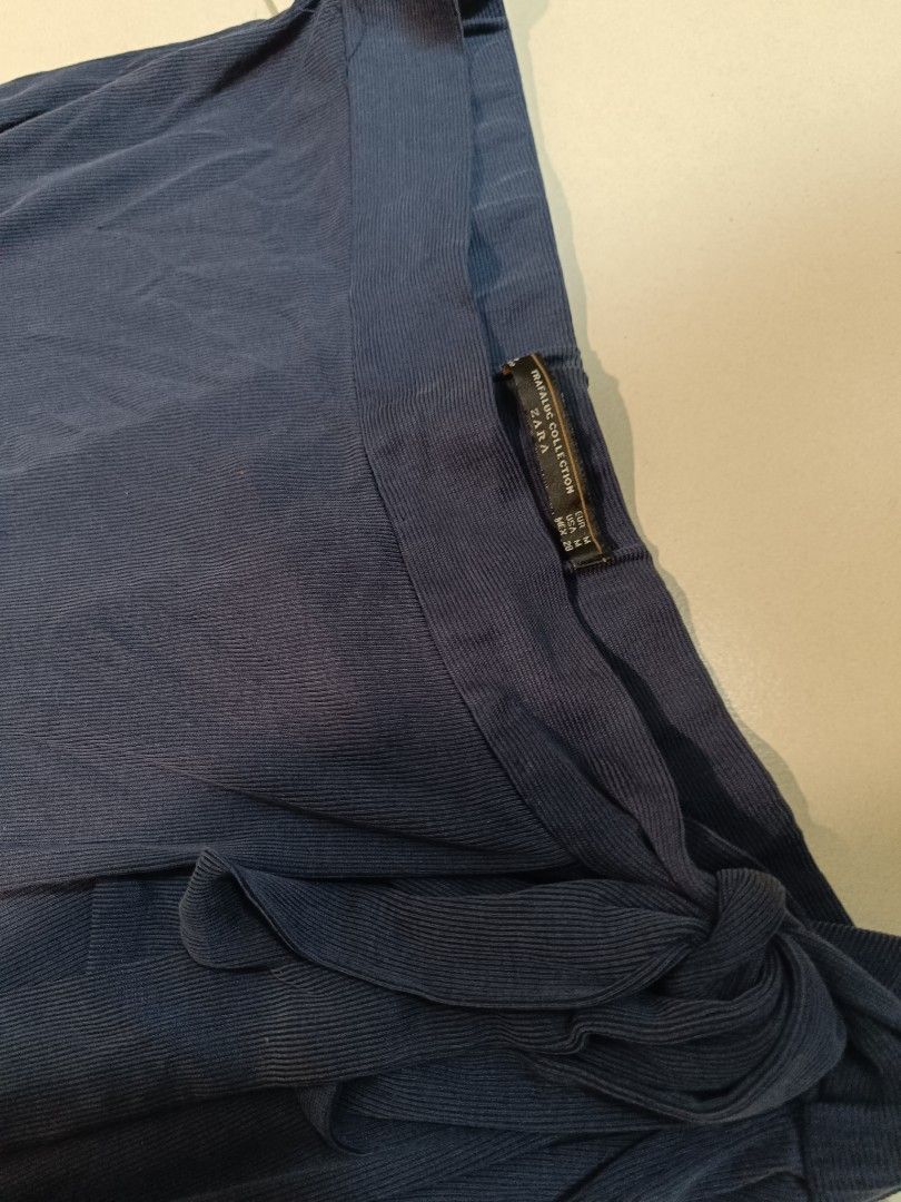 Zara Trafaluc Collection Navy Pants (Category: Other Bottoms) located in Trece Martires City. Submitted by declutterbyedi (Listing ID 1427662864, Image 3). Description: Navy pants from Zara's Trafaluc Collection. Features a unique design with a knot detail. The pants are a size M. The pants have a wide leg cut. Perfect for a casual yet stylish look..