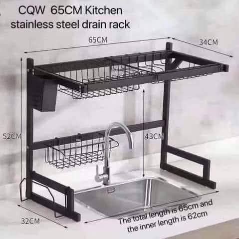 65CM Steel Kitchen Drain Rack (Category: Other Kitchenware & Tableware) located in Manila. Submitted by yzlshop (Listing ID 1427804584, Image 1). Description: Stainless steel kitchen drain rack is 65cm wide and 34cm deep. It has a total height of 52cm and a 43cm height for the lower rack. The inner length is 62cm. It includes a utensil holder and a basket for additional storage. It is designed to fit over a kitchen sink..