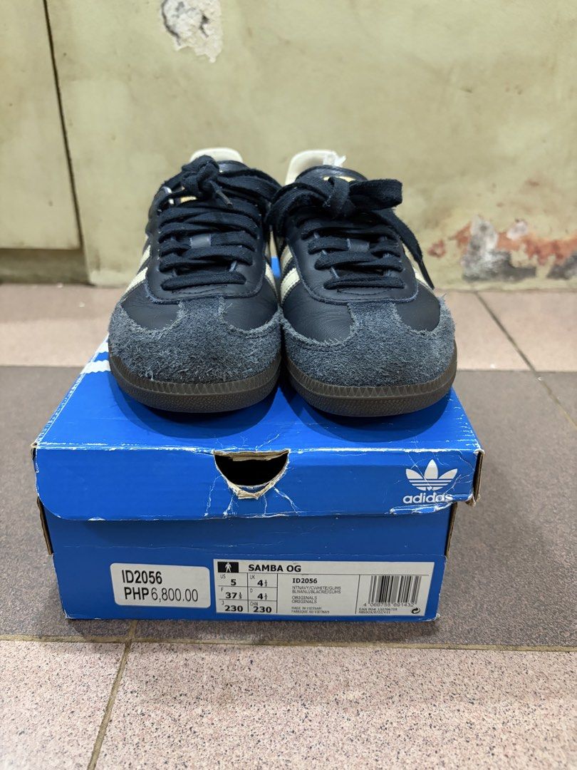 Adidas Samba OG Navy Blue (Category: Sneakers) located in Quezon City. Submitted by brandedthingsforless (Listing ID 1427789712, Image 1). Description: Adidas Samba OG in navy blue. Features the classic three stripes design. Comes with the original box. The shoes have a navy blue suede toe and leather upper. The size is indicated on the box. Perfect for everyday wear..