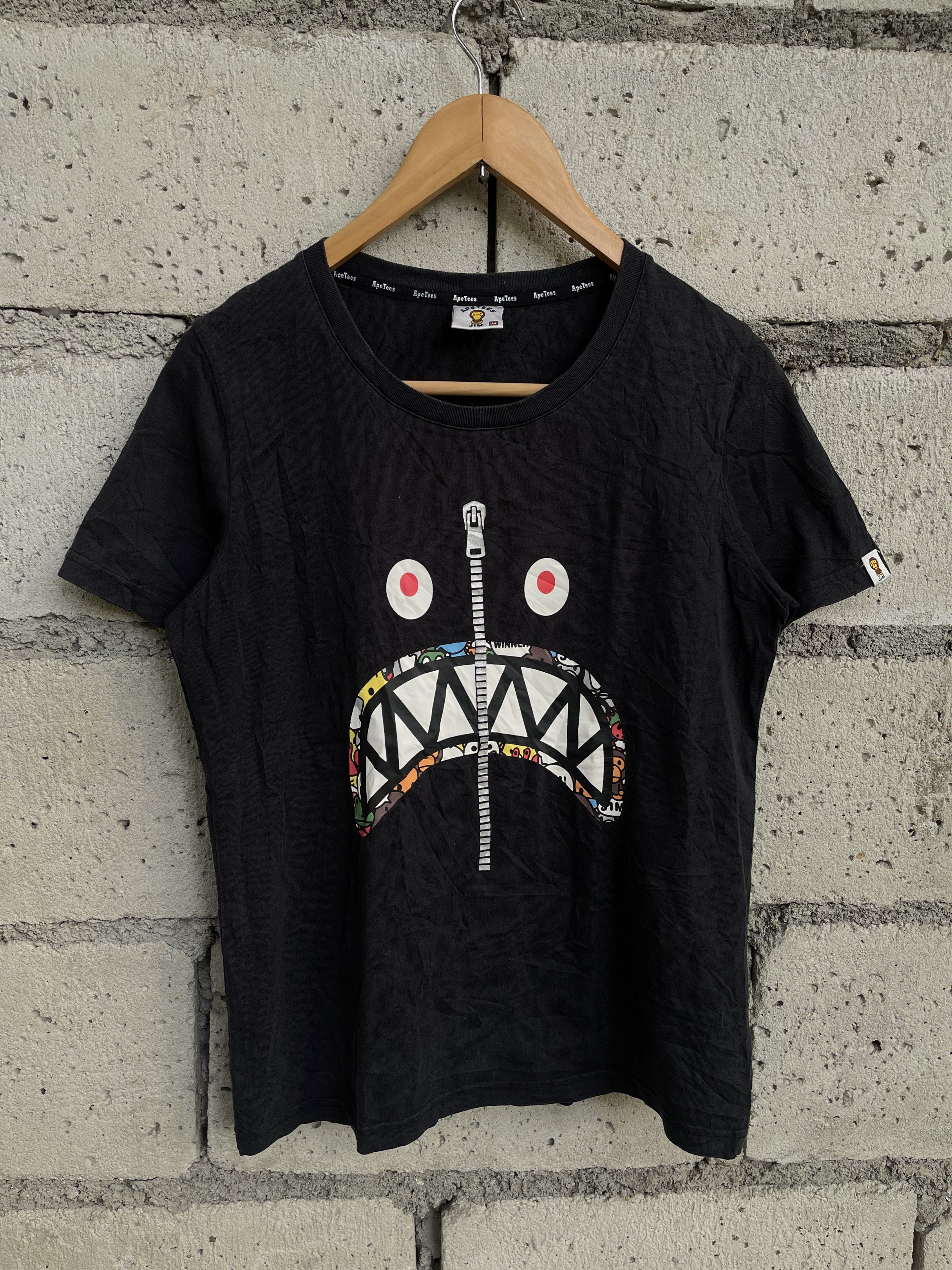 Ape Tees Shark Face T-shirt (Category: Shirts) located in Bulacan. Submitted by OG_Domsthrift (Listing ID 1427781678, Image 1). Description: Ape tees jim tee (women’s) Medium on tag 19x25 No issue Color rate:9/10.