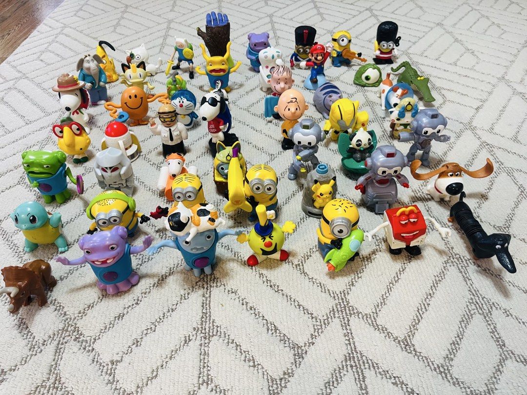 Assorted McDonald's Happy Meal Toys (free shipping) (Category: Character Goods) located in Subic. Submitted by mr_niceguy001 (Listing ID 1427806540, Image 1). Description: (Macdonal Toys ang Hotwheels) (All in 500 pesos) Collection of various McDonald's Happy Meal toys. Includes characters from popular franchises like Pokemon, Minions, Snoopy, and more. Also features a variety of toy cars and other figures. Great for collectors or kids who love t