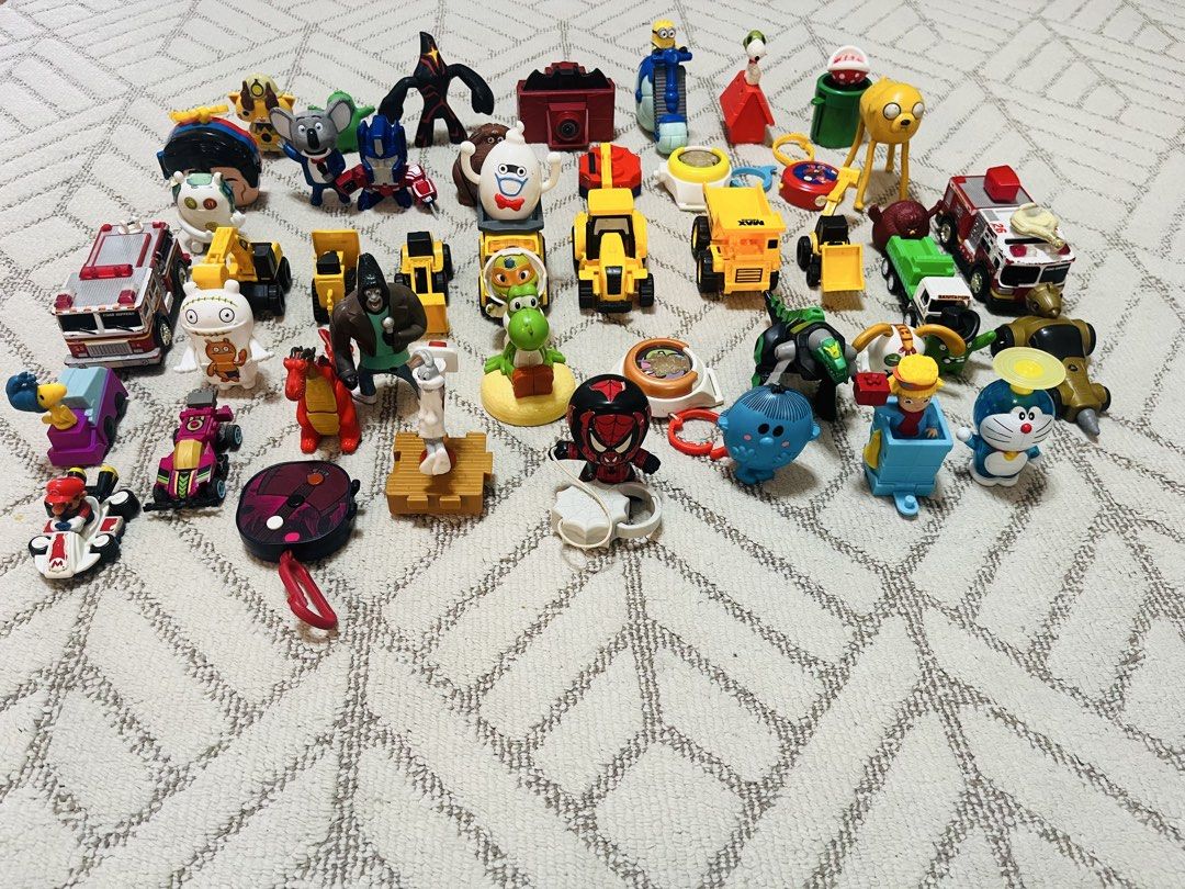 Assorted McDonald's Happy Meal Toys (free shipping) (Category: Character Goods) located in Subic. Submitted by mr_niceguy001 (Listing ID 1427806540, Image 3). Description: (Macdonal Toys ang Hotwheels) (All in 500 pesos) Collection of various McDonald's Happy Meal toys. Includes characters from popular franchises like Pokemon, Minions, Snoopy, and more. Also features a variety of toy cars and other figures. Great for collectors or kids who love t