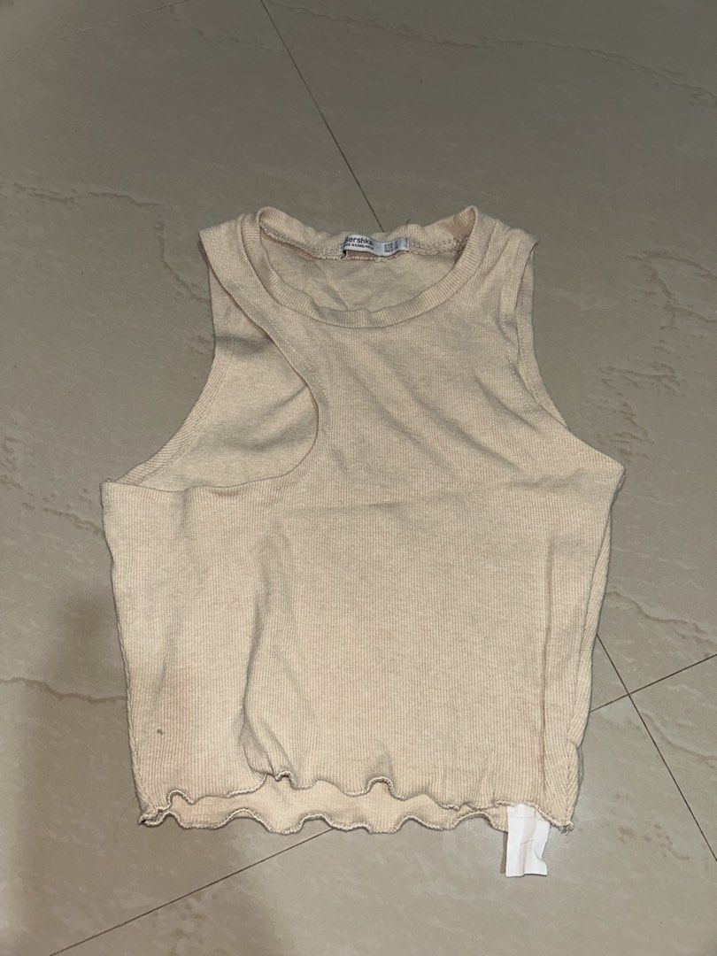 Bershka Beige Ribbed Tank Top (Category: Sleeveless) located in Tuguegarao City. Submitted by imaclr (Listing ID 1427808210, Image 1). Description: hi! visit my profile for more pre-loved clothes. price is negotiable esp if you buy more items :) thank you! :).