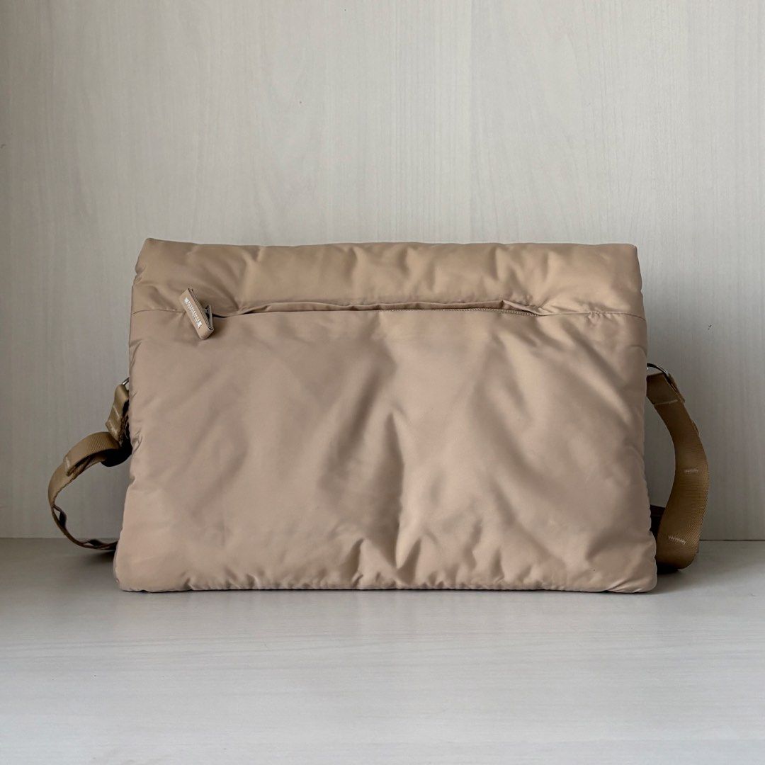 Blanc Nue Pillow Clutch Modular Puffer Bag (Category: Sling Bags) located in Quezon City. Submitted by a.archive.co (Listing ID 1427850876, Image 3). Description: Blanc Nué Pillow Clutch Modular Puffer Bag Colour: Cream Features: - Modular (2-way customizable bag) - Puffer, lightweight Condition: Brand new, never used RFS: Supposedly bought as a gift Mode of Payment: GCash Location: Quezon City.