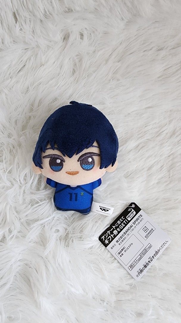 Blue Lock Isagi U-20 Chibigurumi (Category: Plushies & Soft Toys) located in Manila. Submitted by quickocean (Listing ID 1427873283, Image 1). Description: Plushie of a character from Blue Lock. It features a character with blue hair and a blue uniform. The plushie has a tag attached..