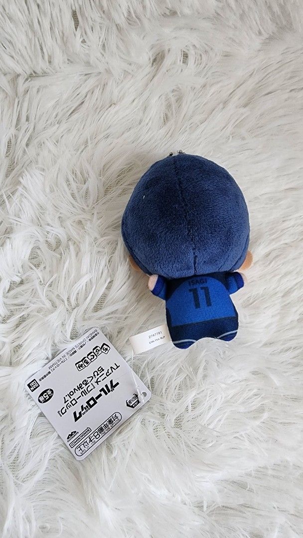 Blue Lock Isagi U-20 Chibigurumi (Category: Plushies & Soft Toys) located in Manila. Submitted by quickocean (Listing ID 1427873283, Image 2). Description: Plushie of a character from Blue Lock. It features a character with blue hair and a blue uniform. The plushie has a tag attached..