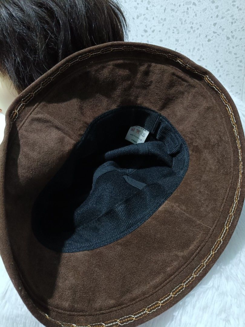 Brown Bucket Hat (Category: Hats & Beanies) located in Tagum. Submitted by zerkinbrylethrift (Listing ID 1427857246, Image 3). Description: Brown bucket hat features a wide brim and a soft, suede-like texture. The interior is lined with a dark fabric. It's a stylish accessory for sun protection or adding a touch of flair to any outfit..