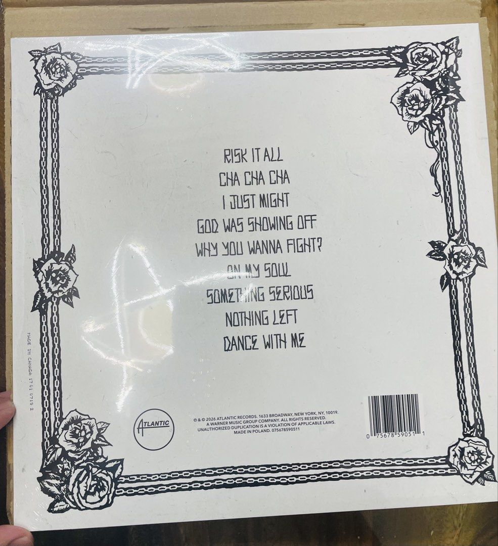 Bruno Mars - The Romantic Vinyl Record [BLACK] (Category: Vinyls) located in Bacoor. Submitted by jescords (Listing ID 1423298291, Image 2). Description: Preorder - Bruno Mars "The Romantic" vinyl record. - Album cover features a black and white illustration of Bruno Mars. - Black vinyl with album title and roses on the label. - Ideal for Bruno Mars fans and vinyl collectors..
