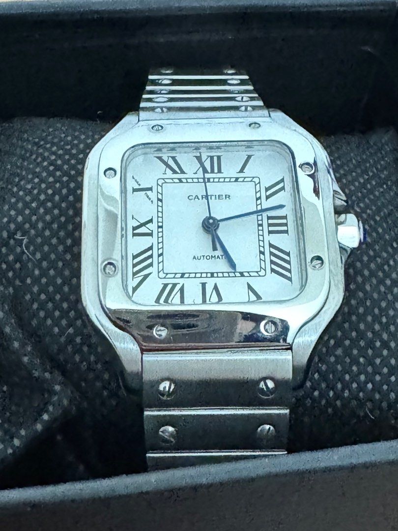 Cartier Santos Medium Automatic (Category: Luxury Watches) located in Quezon City. Submitted by jellyaceeyoo (Listing ID 1427880747, Image 2). Description: • Price listed is slightly negotiable • Item was sourced from surplus • Self-authentication needed • Size: 35mm • Automatic Watch • Inclusions: Box and watch.
