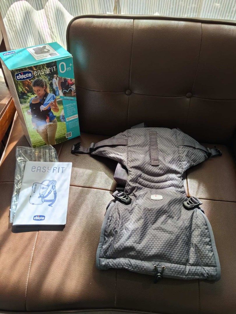 Chicco EasyFit Ergonomic Carrier (Category: Carriers & Slings) located in Quezon City. Submitted by daned05 (Listing ID 1427825451, Image 1). Description: Chicco EasyFit Ergonomic Carrier - Ergonomic design for comfort - Adjustable straps - Neutral gray color - Includes original box and manual - Suitable for newborns and infants up to 9 kg, providing comfortable and ergonomic support. https://chicco.com.ph/products/chicco-easyfit-ergonomic-carrie