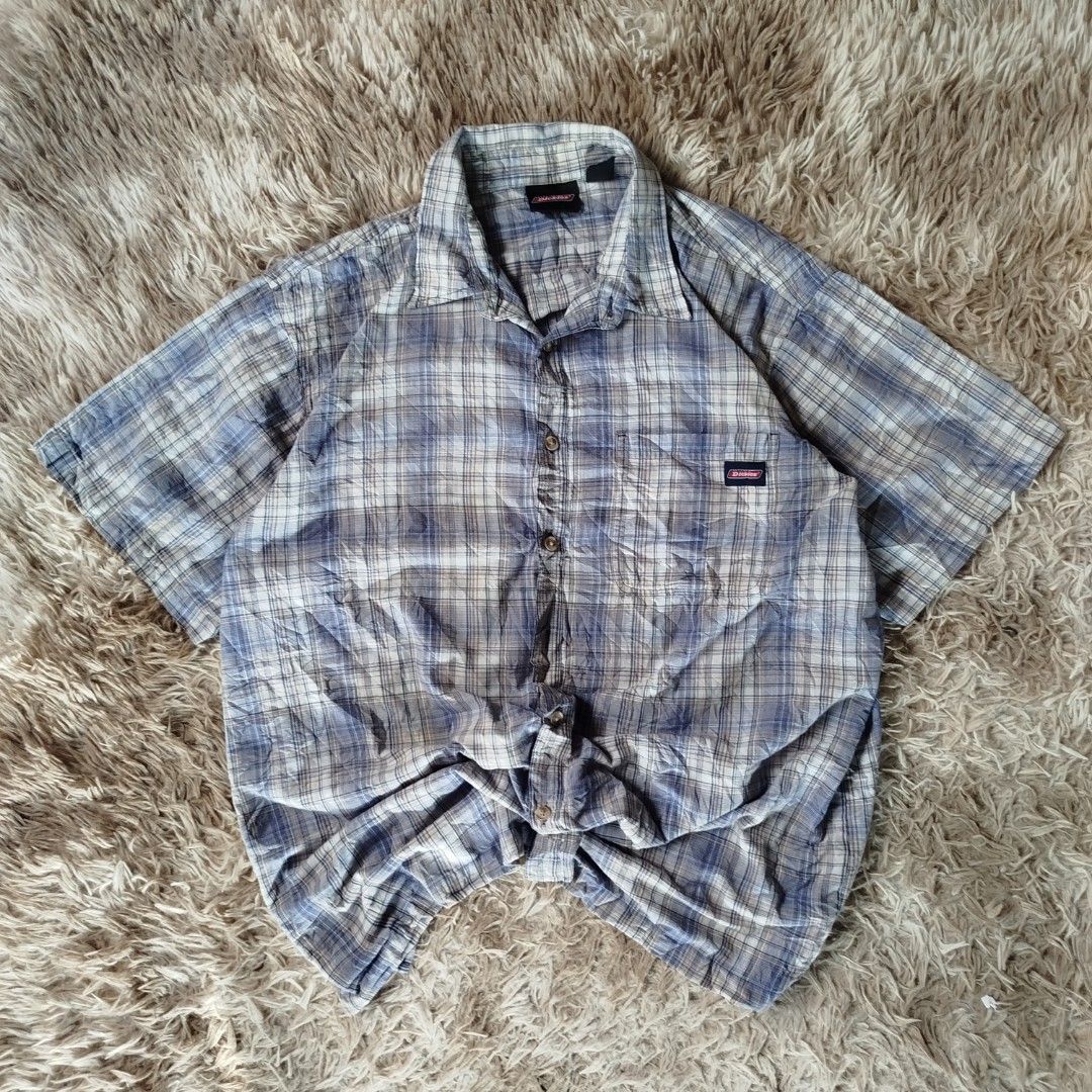 Dickies Plaid Short Sleeve 2xl(authentic) (Category: Tshirts & Polo Shirts ) located in Jaen. Submitted by pitss06 (Listing ID 1427860524, Image 1). Description: Dickies plaid short sleeve shirt. Features a button-down front, a chest pocket with the Dickies logo, and a classic collar. The shirt is a 2XL size. Made with a blend of 60% cotton and 40% polyester. The shirt has a blue and white plaid pattern..