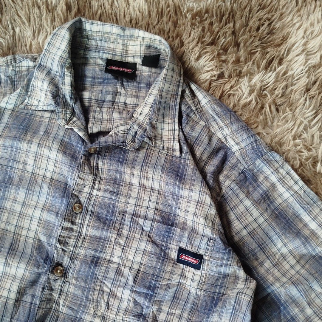 Dickies Plaid Short Sleeve 2xl(authentic) (Category: Tshirts & Polo Shirts ) located in Jaen. Submitted by pitss06 (Listing ID 1427860524, Image 3). Description: Dickies plaid short sleeve shirt. Features a button-down front, a chest pocket with the Dickies logo, and a classic collar. The shirt is a 2XL size. Made with a blend of 60% cotton and 40% polyester. The shirt has a blue and white plaid pattern..