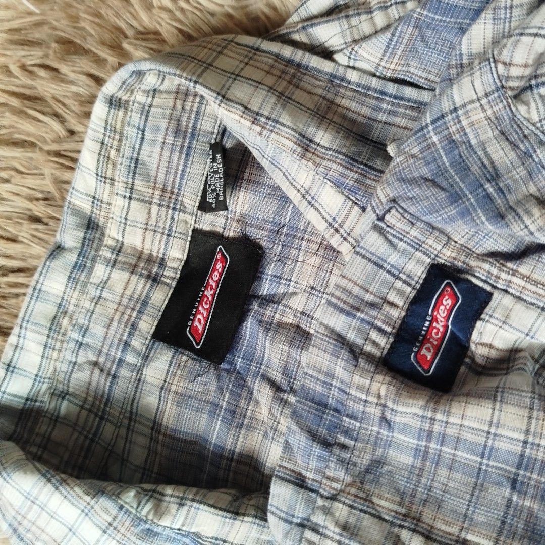 Dickies Plaid Short Sleeve 2xl(authentic) (Category: Tshirts & Polo Shirts ) located in Jaen. Submitted by pitss06 (Listing ID 1427860524, Image 2). Description: Dickies plaid short sleeve shirt. Features a button-down front, a chest pocket with the Dickies logo, and a classic collar. The shirt is a 2XL size. Made with a blend of 60% cotton and 40% polyester. The shirt has a blue and white plaid pattern..