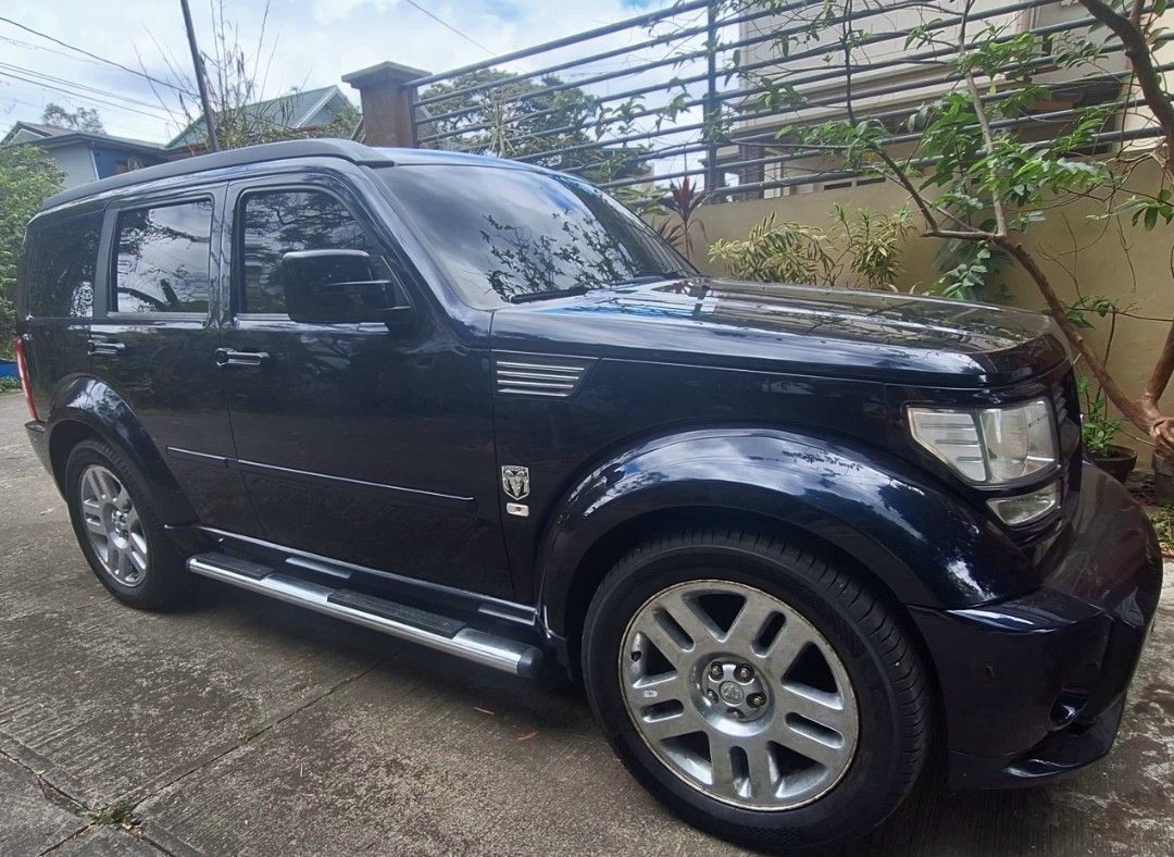Dodge Nitro NEGOTIABLE Dodge Auto (Category: Used Cars) located in Pasig City. Submitted by tatashki (Listing ID 1358957703, Image 1). Description: Dodge Nitro SXT for sale • Body Type SUV • Exterior Color Black Torquise • Doors 4 door • Interior Color : Black with Carbon Fibre accents dashboard and side panels. • Upgraded to Red leather seats • Upgraded to Mechelin Tires with original rims • New Pioneer car audio with Apple and Android play • Se