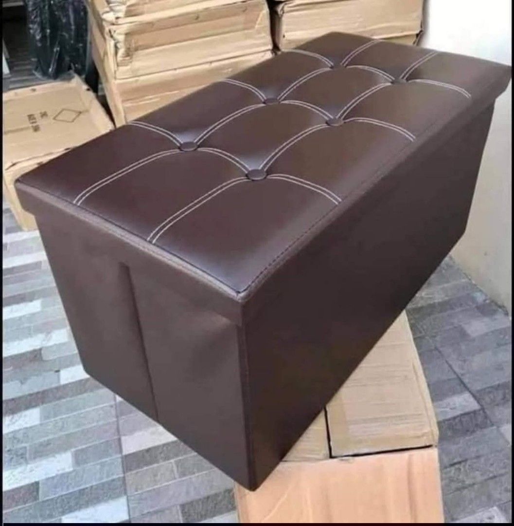 Foldable Box Storage (Category: Chairs) located in Manila. Submitted by haideshop (Listing ID 1427804925, Image 2). Description: Stylish and functional foldable storage ottoman. Features a tufted top with white stitching. Available in various colors including black, brown, pink, white, blue, and red. Provides ample storage space and can also be used as a bench. Perfect for any room in your home..