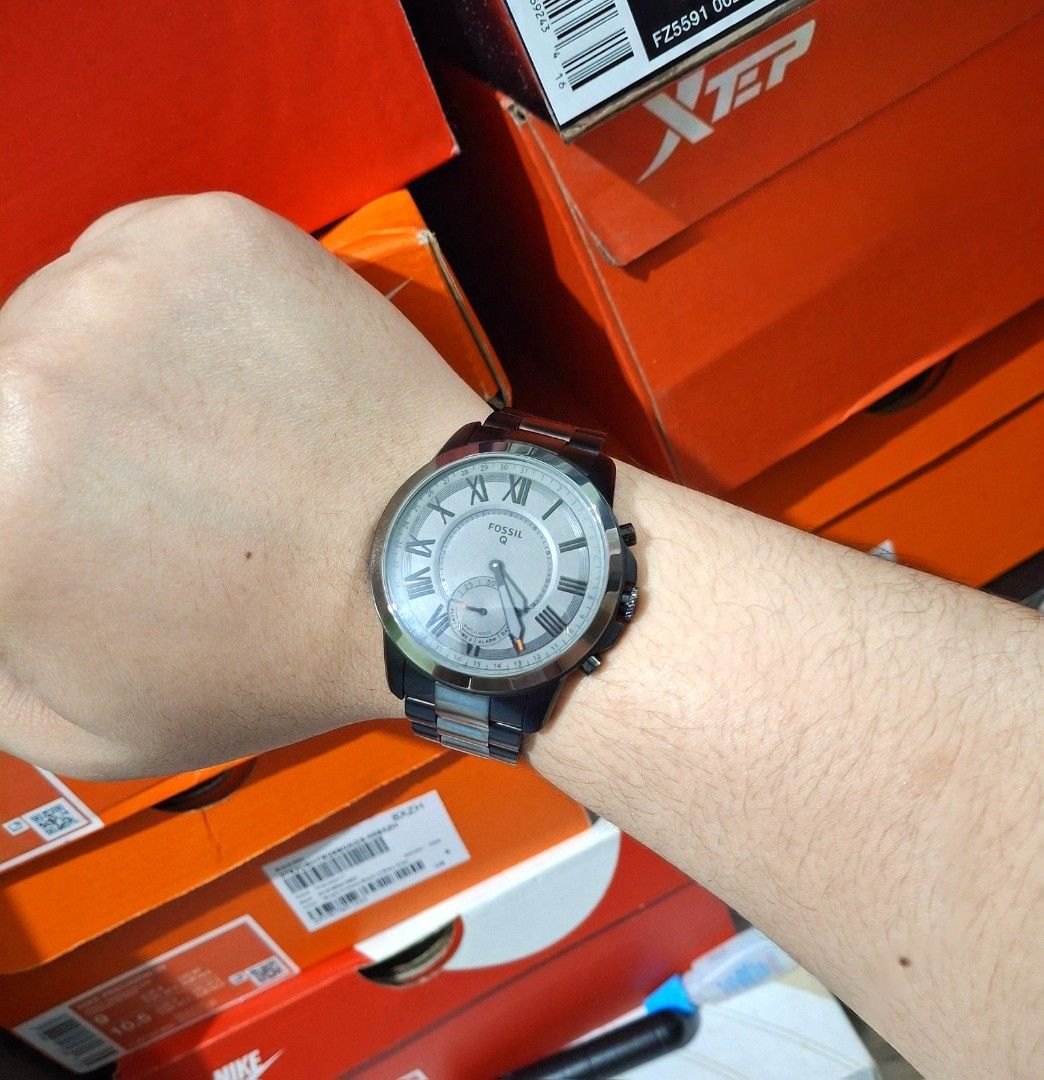 Fossil Q Hybrid Smartwatch (Category: Men's Watches) located in Manila. Submitted by toybuddysnkrs (Listing ID 1427822541, Image 1). Description: Fossil Q Hybrid Smartwatch with a silver and black band. The watch has a grey face with Roman numeral hour markers. Comes with the original box, manual, and charging cable. -lalamove/Gcash -Original -Brand New -Tayuman,Manila.