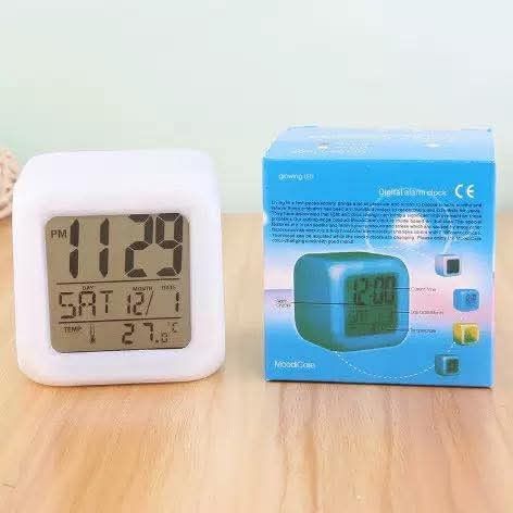 Glowing LED Color Change Digital Alarm Clock (Category: Clocks) located in Manila. Submitted by yzlshop (Listing ID 1427799279, Image 2). Description: Digital alarm clock features a color-changing LED display. It shows the time, date, day, and temperature. The clock has a cube design and comes with its original box..