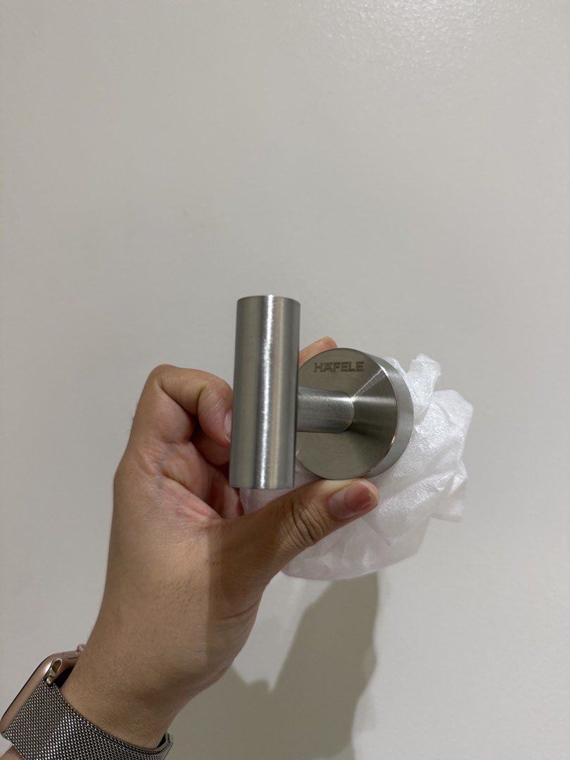 Hafele Stainless Steel Wall Hook (Category: Home Improvement Tools & Accessories) located in Pasig City. Submitted by affordablestuffph (Listing ID 1427844871, Image 2). Description: Hafele stainless steel wall hook. It features a circular base with the Hafele logo and a cylindrical hook. The back of the hook has a screw for mounting..