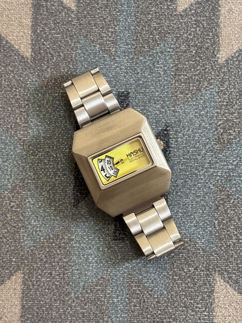 Hashu Electronvolt Digital Model Jump Hour Vintage Design Watch (Category: Men's Watches) located in Cebu City. Submitted by anythingwithvalue (Listing ID 1427848158, Image 1). Description: Hashu Electronvolt digital model. quartz movement. battery operated. New York design. since 1970 branding. jump hour style display. unique rotating disc. conversation piece. yellow dial. very eye catching. retro futuristic look. 1970s inspired design. strong v