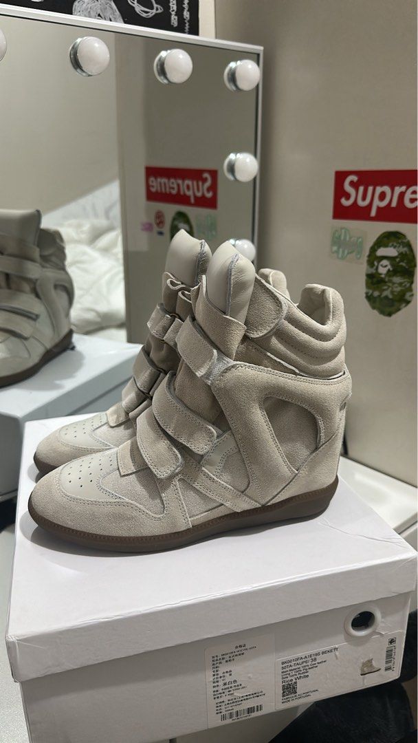 Isabel Marant Wedge Bekett Sneakers (Category: Sneakers) located in Manila. Submitted by luvsosa (Listing ID 1425748950, Image 1). Description: - All Sizes Available -Other Colorways Available -With Box and Tote Bag - DM IF U WANT PROOF OF PURCHASE OR OTHER INQUIRIES -MOP: Gcash -MOD: J&T or Lalamove.