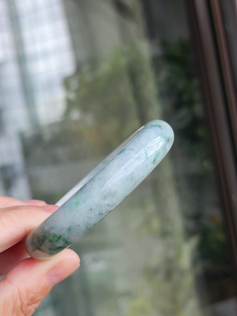 Jadeite Jade Bangle size 55.6 authentic with Certificate (Category: Bracelets) located in Manila. Submitted by cavalierdolls (Listing ID 1427821135, Image 2). Description: Beautiful jadeite jade bangle with a mix of green and white hues. The bangle has a smooth, polished surface size 55.6mm with Certificate. The jadeite jade is translucent, allowing light to pass through. It is a perfect accessory for everyday wear or special occasions..