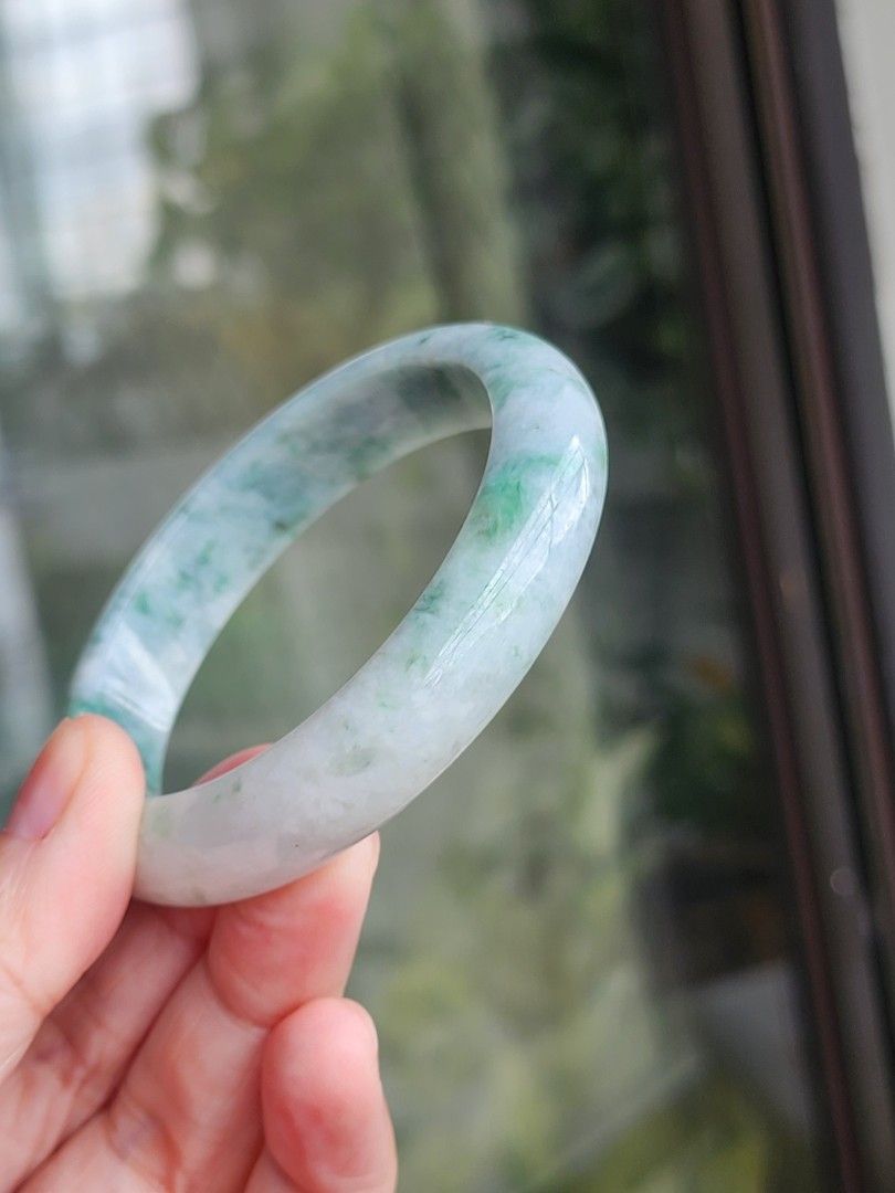 Jadeite Jade Bangle size 55.6 authentic with Certificate (Category: Bracelets) located in Manila. Submitted by cavalierdolls (Listing ID 1427821135, Image 3). Description: Beautiful jadeite jade bangle with a mix of green and white hues. The bangle has a smooth, polished surface size 55.6mm with Certificate. The jadeite jade is translucent, allowing light to pass through. It is a perfect accessory for everyday wear or special occasions..
