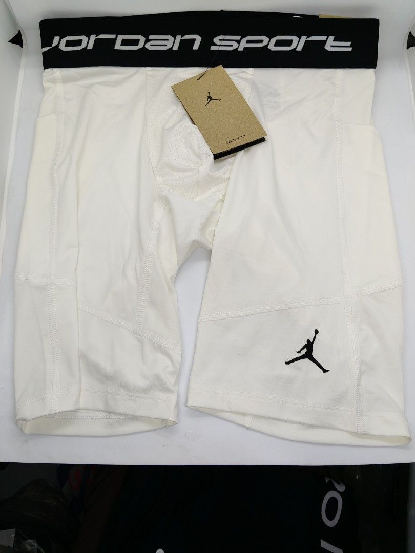 Jordan Sport Compression Shorts (Category: Activewear) located in Baguio. Submitted by all_uneed2600 (Listing ID 1427812891, Image 1). Description: These Jordan Sport compression shorts are white and feature a black waistband with the Jordan Sport logo. They have a pocket on the side and the iconic Jumpman logo. The shorts appear to be new with the original tag attached..