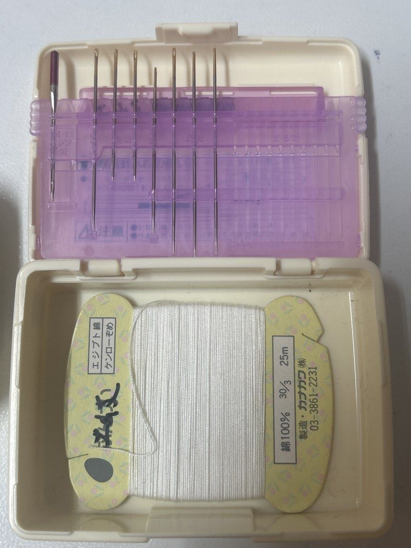 KAI Sewing Kit with Scissors and Needles (Category: Craft Supplies & Tools) located in Bulacan. Submitted by ourdailybreads (Listing ID 1427794141, Image 3). Description: Sewing kit includes a pair of KAI scissors, a small pair of thread snips, a needle case with various needles, a spool of white thread, and a pin cushion. The scissors have the KAI brand logo. The thread is labeled as 100% cotton, 30/3, and 25m. The needle case also has a label i