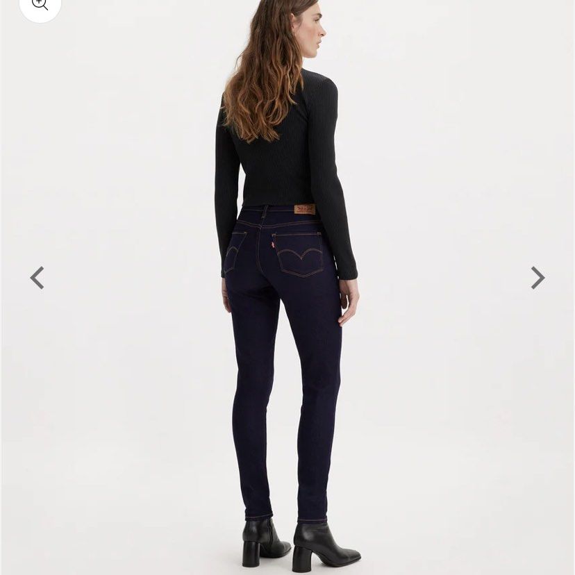 Levi's 710 Super Skinny Jeans (Category: Jeans) located in Mandaluyong City. Submitted by decluttermyitems (Listing ID 1427785692, Image 2). Description: Dark wash Levi's 710 Skinny jeans. Features a classic five-pocket design with a button and zip closure. The jeans have the Levi's logo patch on the back and a small red Levi's tag on the back pocket. Size 29. Made in Pakistan..