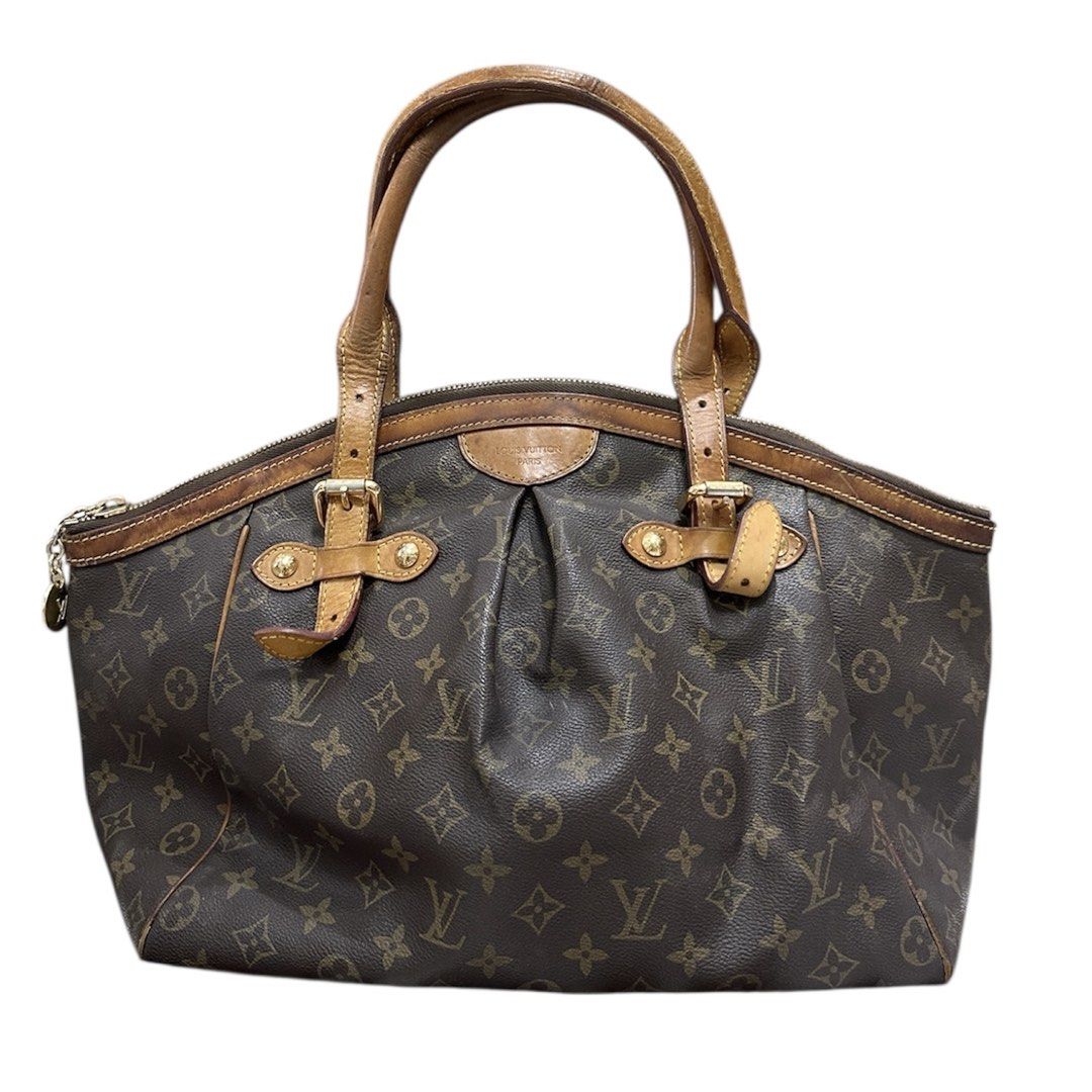 Louis Vuitton Monogram Canvas Bag (Category: Luxury Bags & Wallets) located in Talisay. Submitted by kjujucloset (Listing ID 1427825254, Image 1). Description: Authentic Louis Vuitton handbag in classic Monogram Canvas. Features leather handles and trim with gold-tone hardware. The bag has a zip closure and a spacious interior. The exterior shows the iconic LV monogram pattern. A stylish and functional accessory for everyday use..